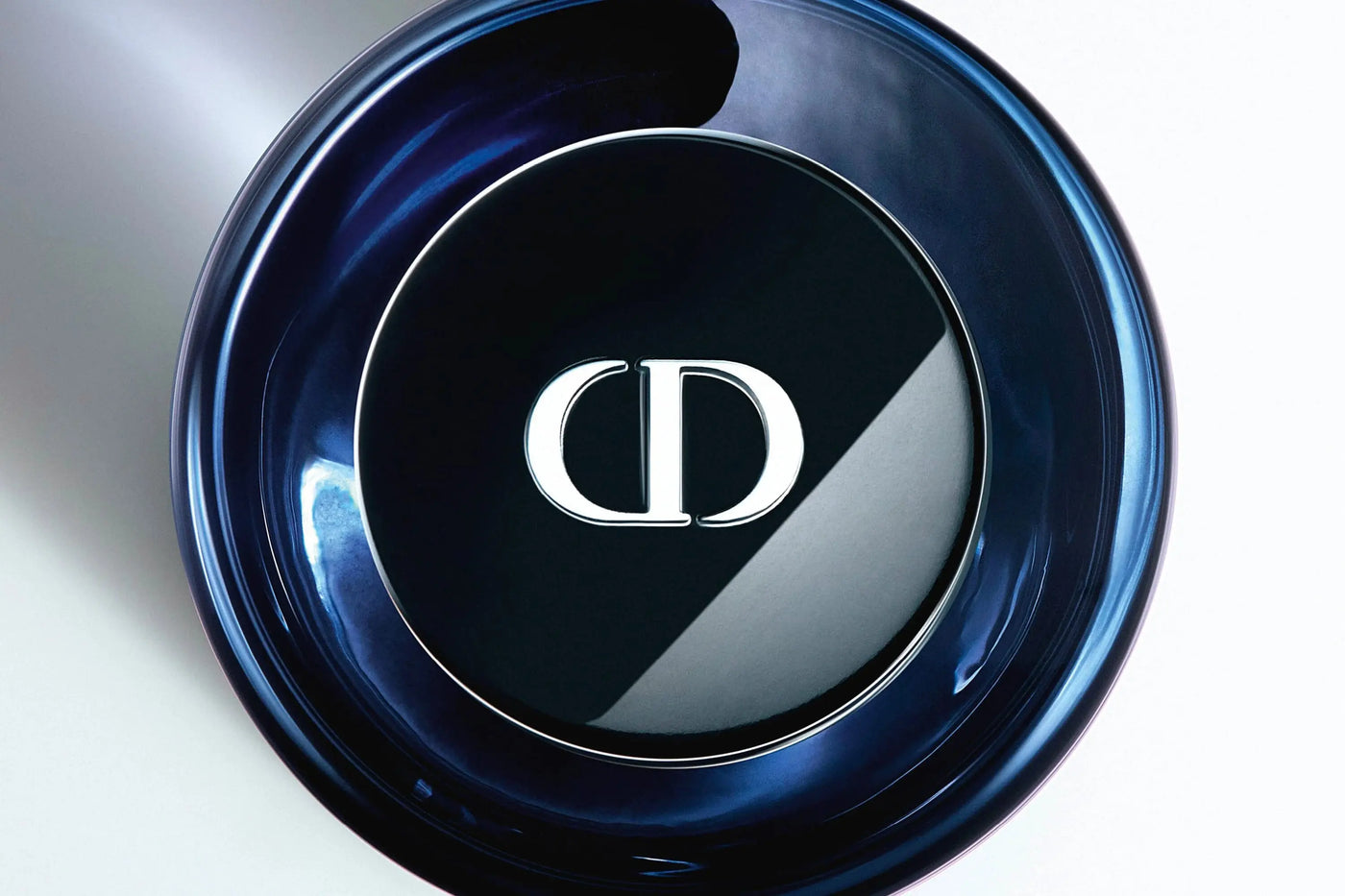 Close-up of a Dior sauvage elixir bottle with the brand logo.